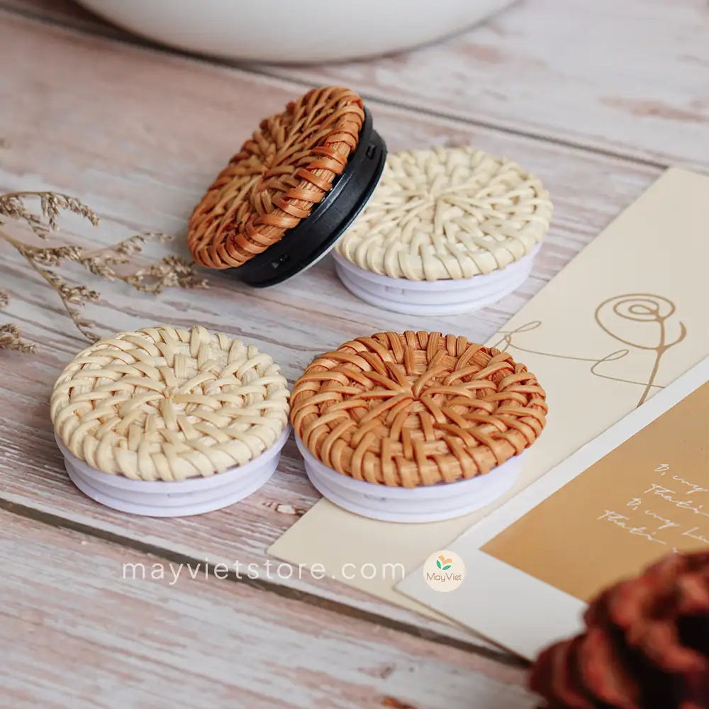 Handwoven rattan phone stand, phone holder, and pop socket in a minimalist design. Perfect for adding a touch of bohemian style to your home or office, or for using on the go.