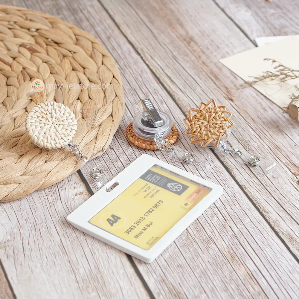 This badge reel clip/card holder is made of rattan. It has a retractable cord and a clip that can be attached to a belt or other clothing. The card holder has three slots for cards, such as a nurse's license and identification card.