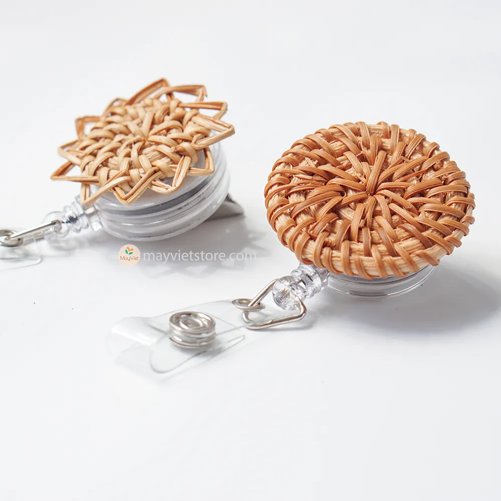 This badge reel clip/card holder is made of rattan. It has a retractable cord and a clip that can be attached to a belt or other clothing. The card holder has three slots for cards, such as a nurse's license and identification card.