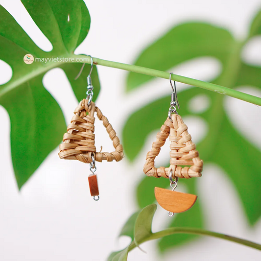 A pair of handcrafted rattan earrings with mini triangular brown wooden beads, made by Mayvietstore. The earrings are made of high-quality rattan and wood, and are lightweight and comfortable to wear. The mini triangular beads add a touch of delicate and minimalist style to the earrings, and the brown wooden beads give them a warm and natural look. These earrings are perfect for any occasion, from a casual day out to a special event.