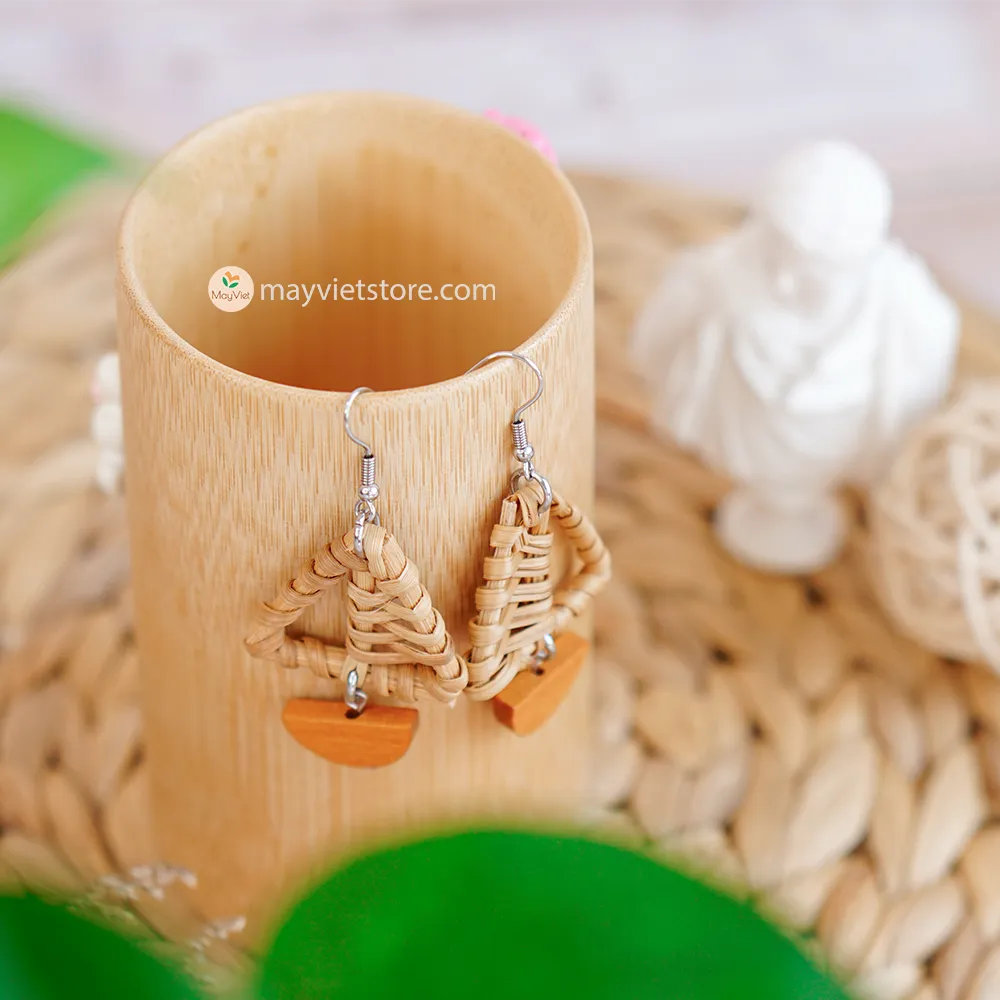 A pair of handcrafted rattan earrings with mini triangular brown wooden beads, made by Mayvietstore. The earrings are made of high-quality rattan and wood, and are lightweight and comfortable to wear. The mini triangular beads add a touch of delicate and minimalist style to the earrings, and the brown wooden beads give them a warm and natural look. These earrings are perfect for any occasion, from a casual day out to a special event.