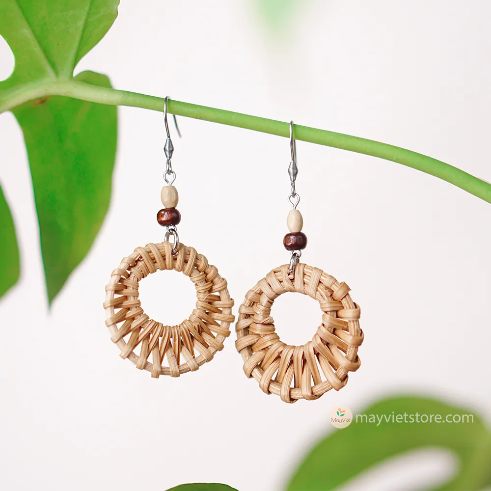 A pair of mini rattan round earrings with wooden beads, handcrafted by Mayvietstore. The earrings are made of high-quality rattan and wood, and are lightweight and comfortable to wear. They are perfect for everyday wear or for special occasions.