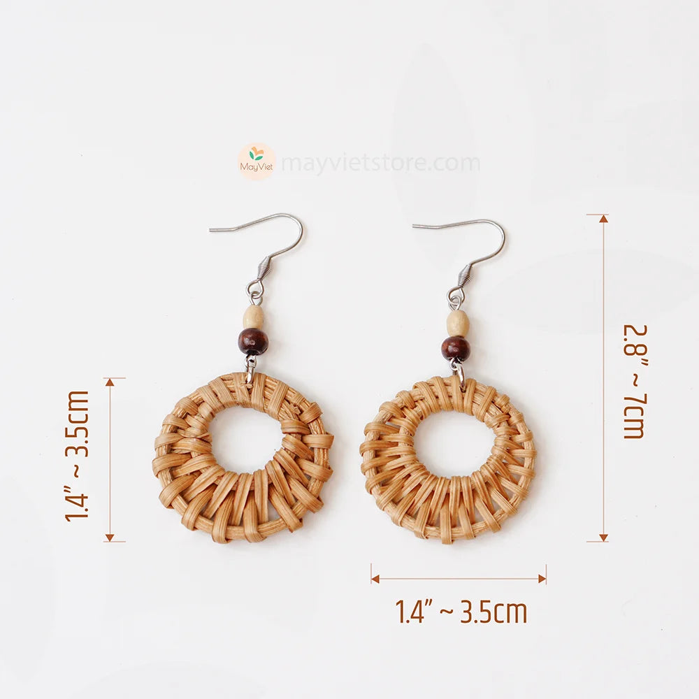 A pair of mini rattan round earrings with wooden beads, handcrafted by Mayvietstore. The earrings are made of high-quality rattan and wood, and are lightweight and comfortable to wear. They are perfect for everyday wear or for special occasions.