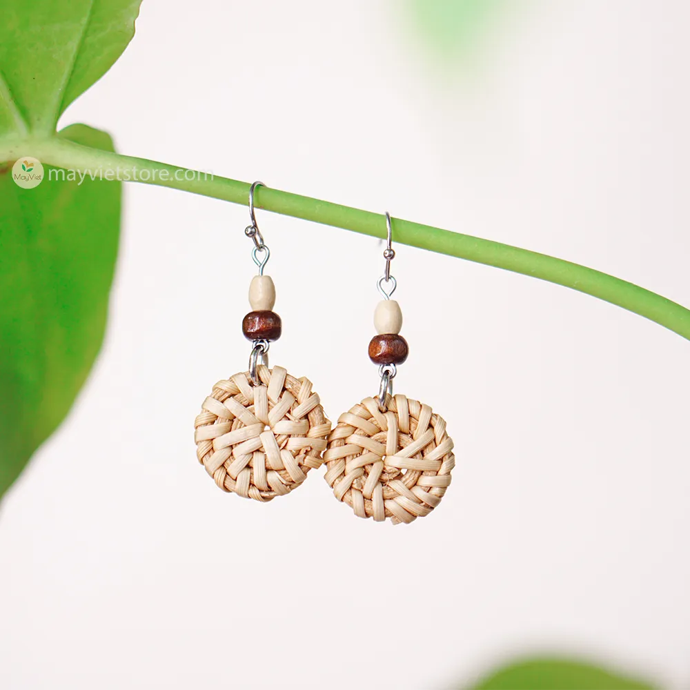A pair of mini rattan round earrings with wooden beads, handcrafted by Mayvietstore. The earrings are made of high-quality rattan and wood, and are lightweight and comfortable to wear. They are perfect for everyday wear or for special occasions.