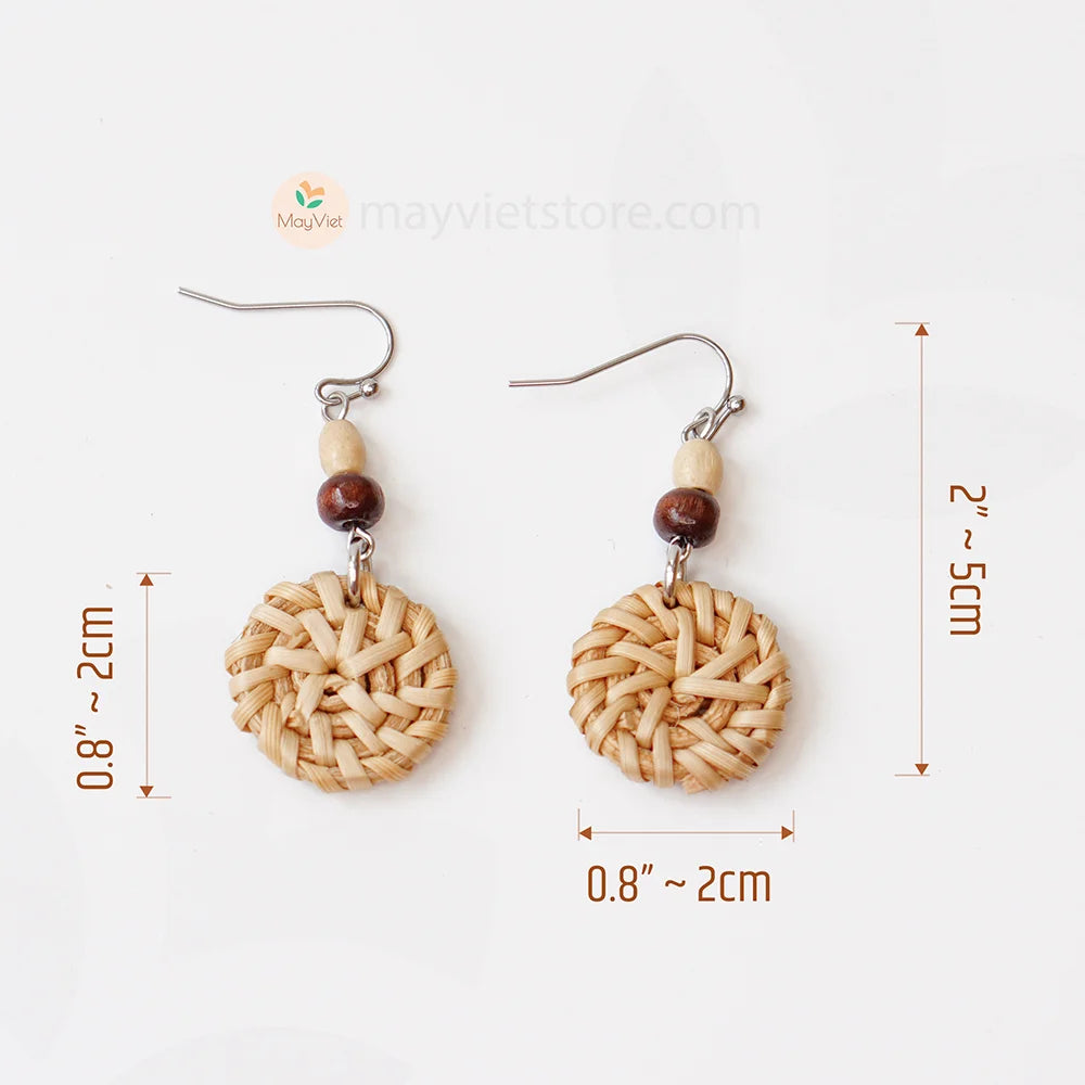 A pair of mini rattan round earrings with wooden beads, handcrafted by Mayvietstore. The earrings are made of high-quality rattan and wood, and are lightweight and comfortable to wear. They are perfect for everyday wear or for special occasions.