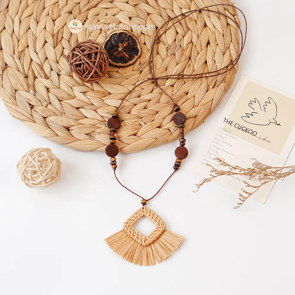 This rattan tassel wooden beads necklace is a fun and flirty accessory. The rattan is lightweight and comfortable to wear, while the wooden beads add a touch of natural beauty. The tassel is long and flowy, making this necklace a statement piece. This necklace is perfect for any occasion, from a casual day out to a summer party.