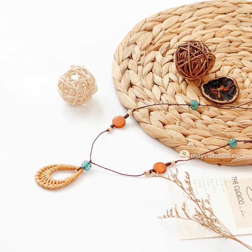 This rattan teardrop wooden beads necklace is a beautiful and elegant accessory. The rattan is lightweight and comfortable to wear, while the wooden beads add a touch of natural beauty. The teardrop shape is flattering and feminine, making this necklace perfect for any occasion.