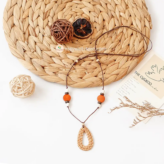 This rattan teardrop wooden beads necklace is a unique and stylish accessory. The rattan is lightweight and comfortable to wear, while the wooden beads add a touch of natural beauty. The teardrop shape is flattering and feminine, making this necklace perfect for any occasion.