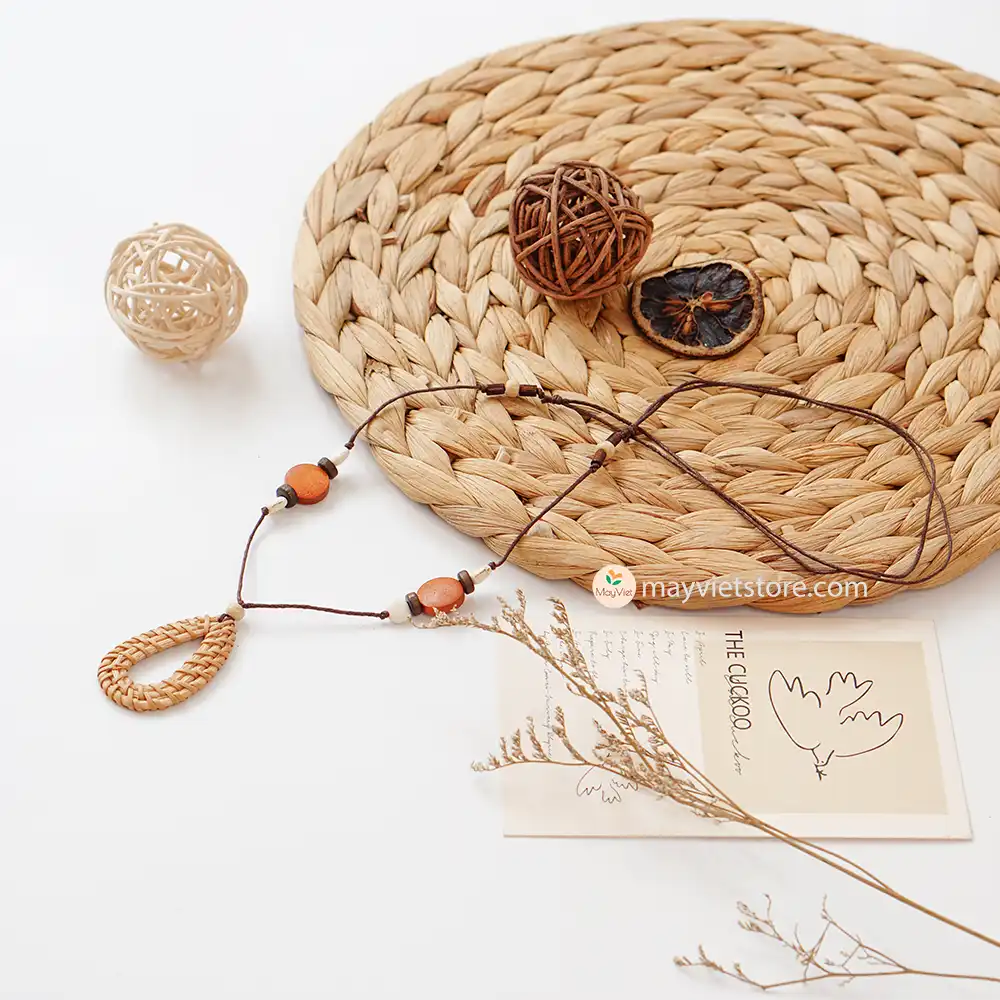 This rattan teardrop wooden beads necklace is a unique and stylish accessory. The rattan is lightweight and comfortable to wear, while the wooden beads add a touch of natural beauty. The teardrop shape is flattering and feminine, making this necklace perfect for any occasion.