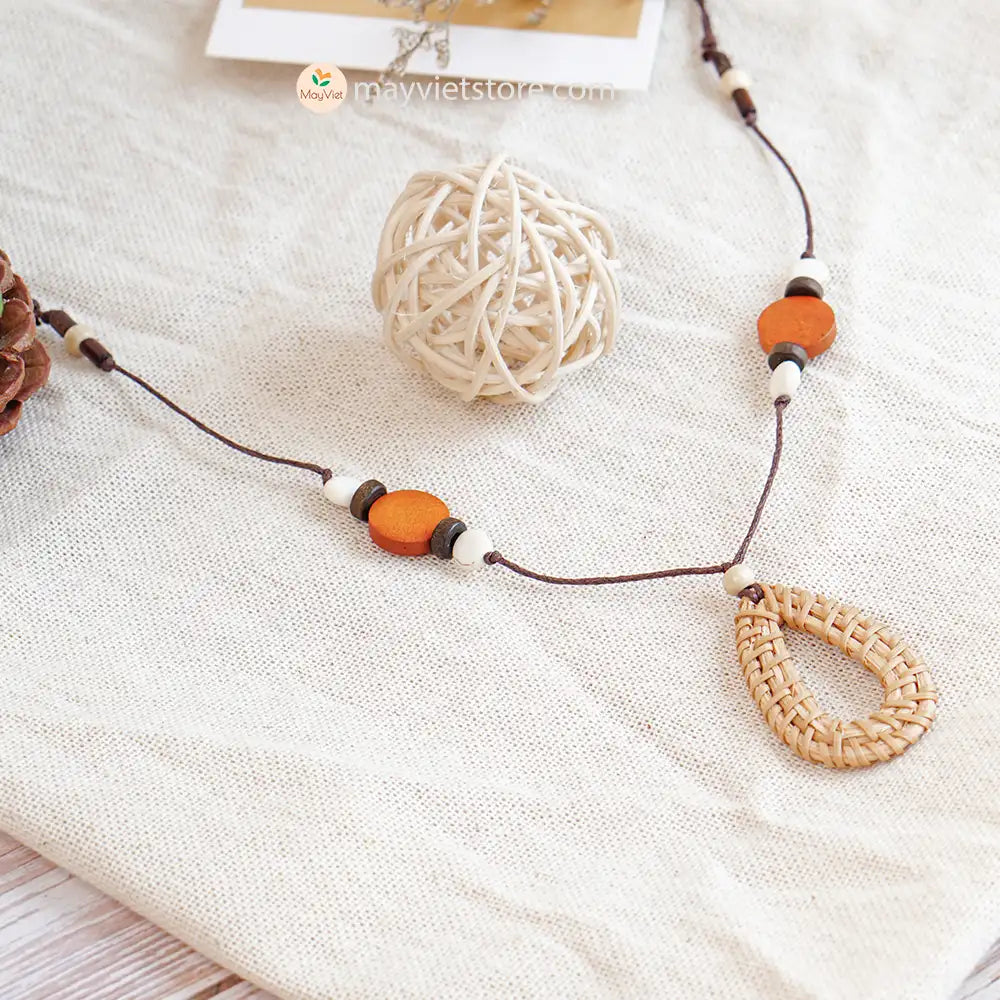 This rattan teardrop wooden beads necklace is a unique and stylish accessory. The rattan is lightweight and comfortable to wear, while the wooden beads add a touch of natural beauty. The teardrop shape is flattering and feminine, making this necklace perfect for any occasion.