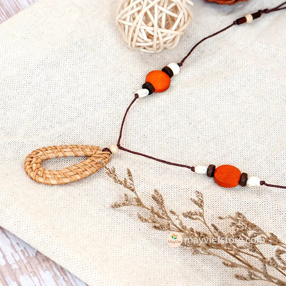 This rattan teardrop wooden beads necklace is a unique and stylish accessory. The rattan is lightweight and comfortable to wear, while the wooden beads add a touch of natural beauty. The teardrop shape is flattering and feminine, making this necklace perfect for any occasion.