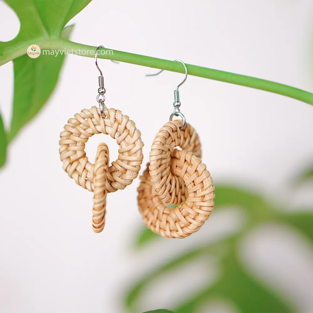 A pair of handcrafted rattan wicker round double earrings, made by Mayvietstore. The earrings are made of high-quality rattan wicker, and are lightweight and comfortable to wear. The double layered design adds a touch of interest and personality, and the rattan wicker gives the earrings a bohemian vibe. These earrings are perfect for any occasion, from a casual day out to a special event.