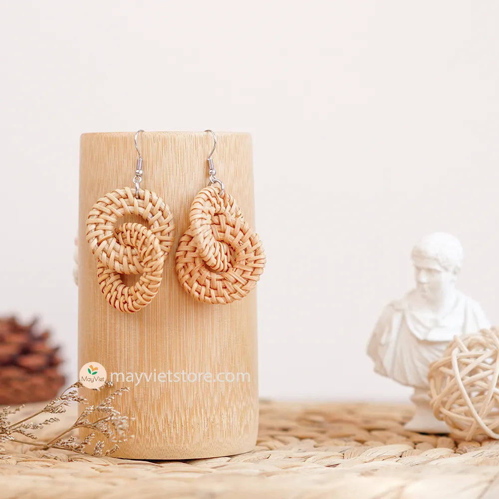 A pair of handcrafted rattan wicker round double earrings, made by Mayvietstore. The earrings are made of high-quality rattan wicker, and are lightweight and comfortable to wear. The double layered design adds a touch of interest and personality, and the rattan wicker gives the earrings a bohemian vibe. These earrings are perfect for any occasion, from a casual day out to a special event.