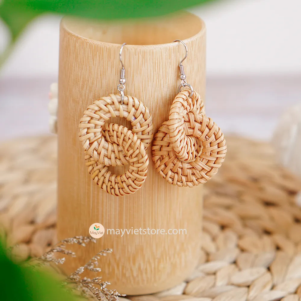 A pair of handcrafted rattan wicker round double earrings, made by Mayvietstore. The earrings are made of high-quality rattan wicker, and are lightweight and comfortable to wear. The double layered design adds a touch of interest and personality, and the rattan wicker gives the earrings a bohemian vibe. These earrings are perfect for any occasion, from a casual day out to a special event.
