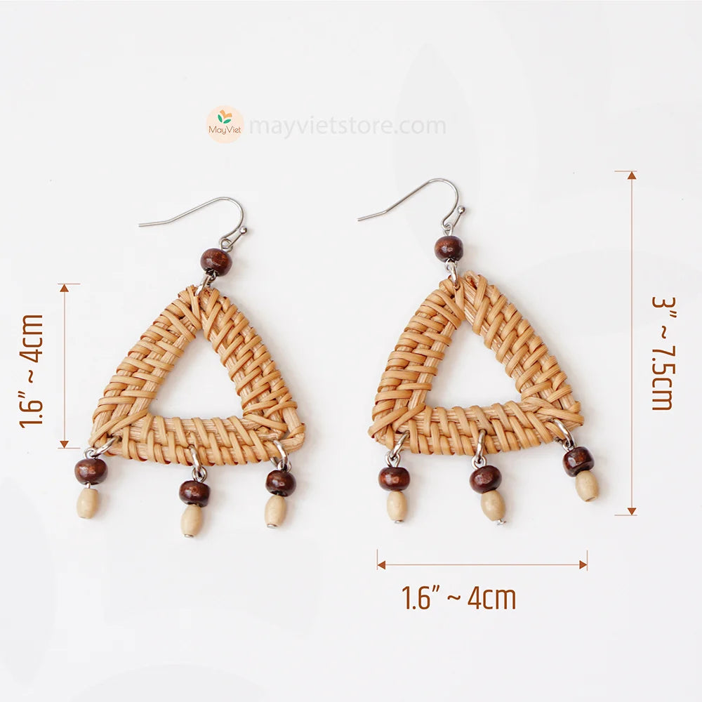 These triangle rattan earrings with brown wooden beads are a stylish and unique accessory. The rattan is lightweight and comfortable to wear, while the brown wooden beads add a touch of natural beauty. The triangle shape is geometric and modern, making these earrings perfect for any occasion.