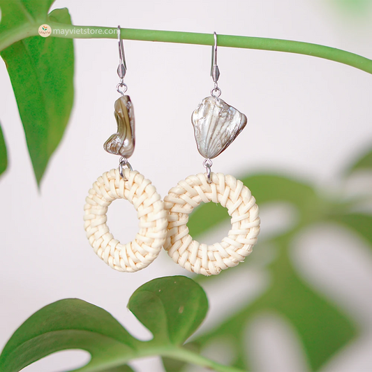 These white rattan hoop earrings with stripe stone beads are a unique and stylish accessory. The rattan is lightweight and comfortable to wear, while the stripe stone beads add a touch of sophistication and shine. The hoop shape is classic and versatile, making these earrings perfect for any occasion.