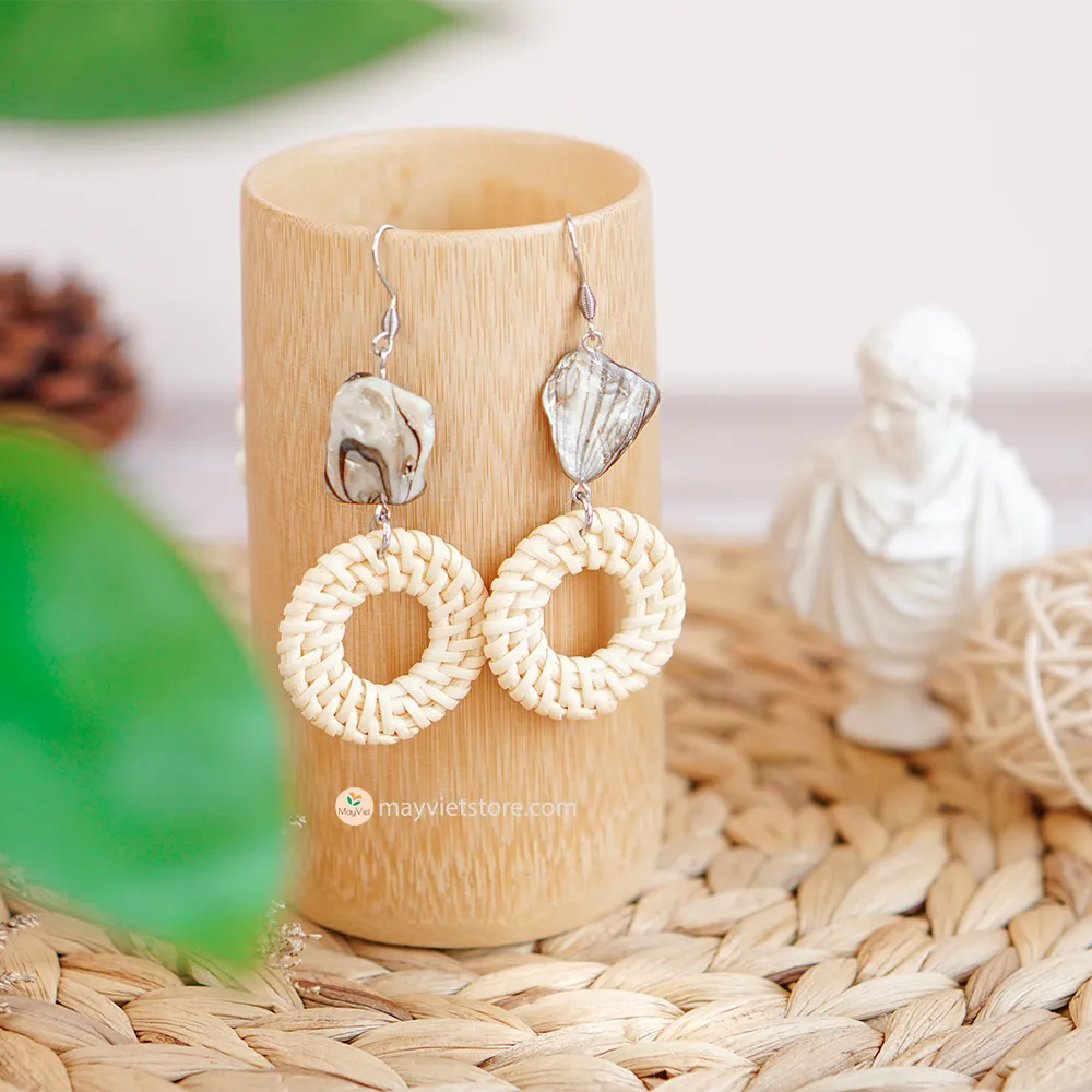 These white rattan hoop earrings with stripe stone beads are a unique and stylish accessory. The rattan is lightweight and comfortable to wear, while the stripe stone beads add a touch of sophistication and shine. The hoop shape is classic and versatile, making these earrings perfect for any occasion.