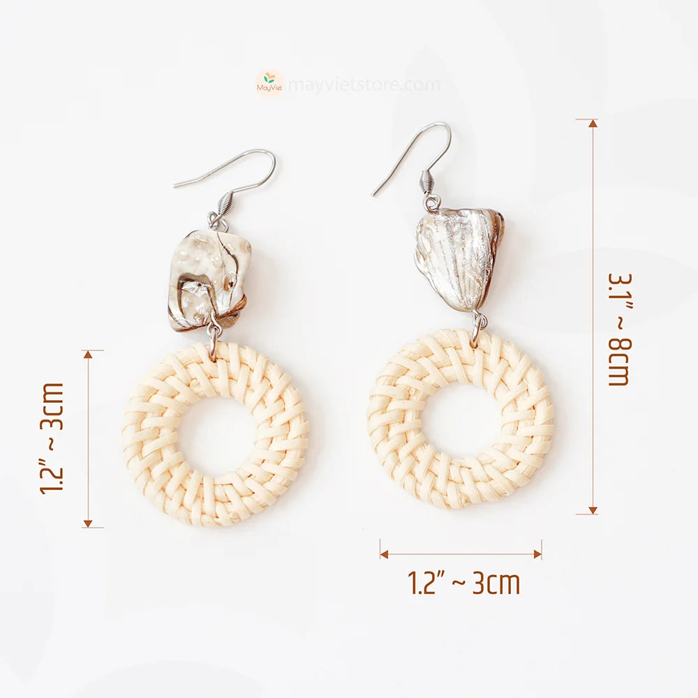 These white rattan hoop earrings with stripe stone beads are a unique and stylish accessory. The rattan is lightweight and comfortable to wear, while the stripe stone beads add a touch of sophistication and shine. The hoop shape is classic and versatile, making these earrings perfect for any occasion.