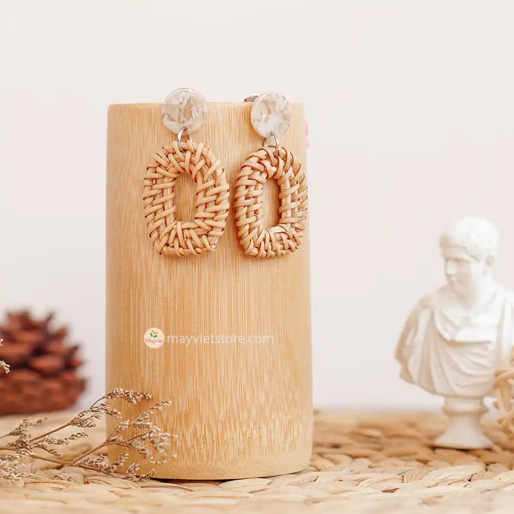 The Mayvietstore Window Shape Rattan Earrings are distinguished by their exceptional window-like design, showcasing natural rattan at their core. What sets them apart is the addition of a lustrous epoxy detail, which not only enhances their aesthetics but also provides a touch of modern sophistication.